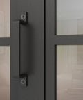 Close-up of handle on Frosted Glass Double Bi Fold Barn Doors with Black Steel Frame 48 Inch By 84 Inch Three Quarter Lites