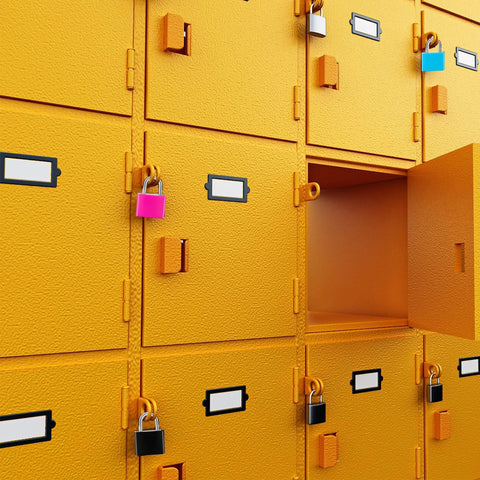 4 Pack Multicolor Keyed Padlocks For Suitcases And Luggage With Two Distinct Keys securing yellow lockers in a storage area.