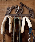 Straight Up Rustic Western Cast Iron Cowboy Coat Wall Mount Hook Featuring Authentic Horse Shoe Shape holding leashes.