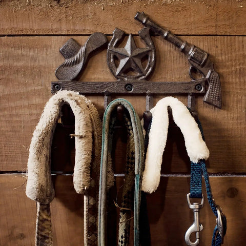 Straight Up Rustic Western Cast Iron Cowboy Coat Wall Mount Hook Featuring Authentic Horse Shoe Shape holding leashes.