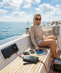 Woman on boat using 12V 20A PWM Solar Charge Controller With Type C USB Output Auto Detects LiFePO4 AGM And Gel Batteries
