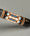 Premium 12Mm Taper Carbon Fiber Shaft Pool Cue With Exotic Wood Butt And Rugged Transport Case close-up of leather grip and decorative butt.