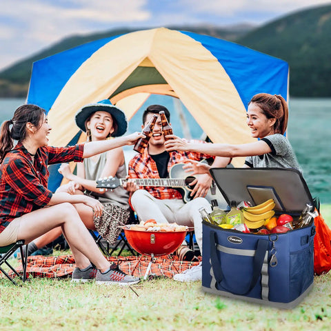 Collapsible Soft Cooler Bag With 75 Can Capacity For Beach And Road Trips Flip Top Lid Leakproof Ice Chest Lightweight Portable Cooler On The Go With 5 Layer Insulation And 12 Hour Cold Retention Great For Camping Groceries In Blue in front of people camping with tent and grill