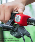 Electric Bike Bell With 90dB Alert And 3 Sound Modes Waterproof Black Finish Easy To Install For Daily Commutes Durable Bicycle Horn For E Bikes Loud Yet Clear Warning For Safer Rides, red silicone bell on bike handlebar