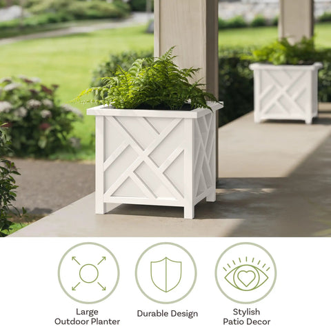 Two-Pack Lattice Outdoor Planter Boxes 15.5 Inch Square 16.5 Inch Tall White Decorative Flower Pots For Front Porch Patio Or Garden Decor Durable Outdoor Planters For Plants featuring a white lattice design with greenery. Visible out on a patio.
