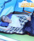 Person in tent using Cozy 3 Season Sleeping Bag For Camping And Backpacking 75x33 Inches Navy Blue With 2lb Hollow Cotton Fill