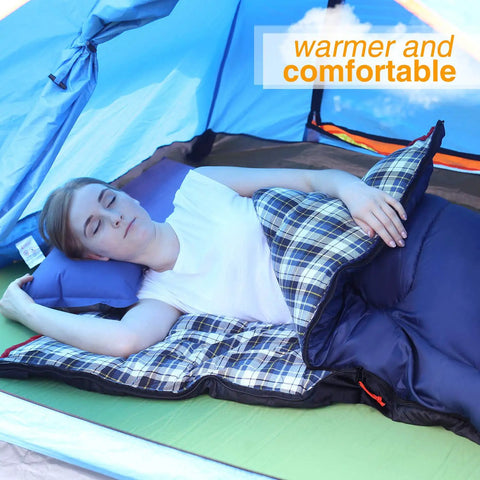 Person in tent using Cozy 3 Season Sleeping Bag For Camping And Backpacking 75x33 Inches Navy Blue With 2lb Hollow Cotton Fill