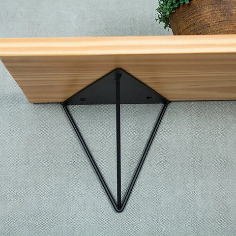 Rock Solid Heavy Duty Shelf Brackets In Matte Black Cast Iron Triangle Wall Mount Supports with wooden shelf.