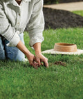 Person installing Smart Wireless Soil Sensor For Lawn And Garden Automatic Moisture Meter With 1 3 And 5 Inch Depth Monitoring