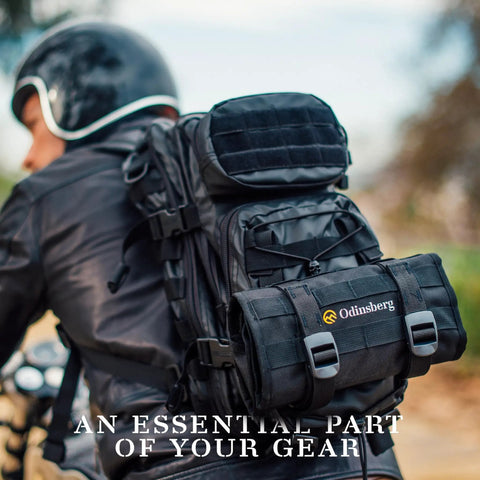 Motorcyclist with Compact Roll Up Motorcycle Tool Bag With MOLLE Strap attached to backpack on ride