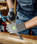 Three Pair Level Five Cut Resistant Gloves With Nitrile Coated Grip protecting hands using tools on wood in workshop