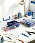 Two Pack Small Plastic Tool Box with Handle 2 Layer Clear Organizer With Removable Divider shown on a workbench with tools.