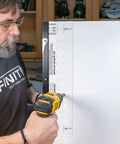 Person using Beefy Shelf Pin Jig For Adjustable Shelves And Cabinets, 19-Inch Aluminum Spine, Dual-Row Indexing With 1.25 Inch Hole Spacing