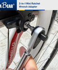 2-In-1 Mini Ratchet Wrench Adapter With Magnetic One Quarter Inch Hex Bit Holder And One Quarter Inch Drive Socket Adapter in use on bike