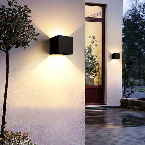 4 Pack Outdoor Indoor LED Wall Lights Sconces IP65 Waterproof Square Aluminum Up And Down Lighting Sleek Black 12W 3000K Warm White 1020 Lumens Wall Lamp For Exterior And Interior Use mounted on a modern house wall exterior