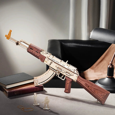 Dope 3D Wooden Puzzle Kit For Adults, DIY Rubber Band Gun Build, decorative AK-47 wood model on a desk with books and lamp