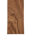 Close-up of Walnut Lumber Board One And Three Quarters By Four By Forty Eight Inches Kiln Dried with dope grain and sanded surfaces.