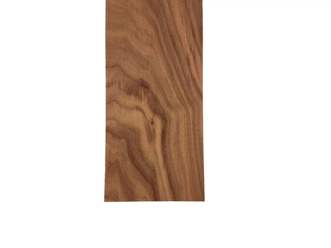 Close-up of Walnut Lumber Board One And Three Quarters By Four By Forty Eight Inches Kiln Dried with dope grain and sanded surfaces.