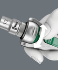 Close-up of holding Zyklop 8000 C Half Inch Drive Ratchet with Five Tools In One showing reversible swivel head operation