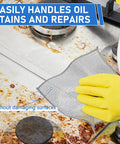 Heavy Duty Non Scratch Steel Wool Dishcloths And Scrubber Pads Kitchen Cleaning Set wiping oil stains off stove surface.