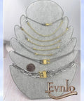 Display of All-In-One Necklace Extender And Magnetic Clasp Set For Layering, Gold And Silver Styles on jewelry stand