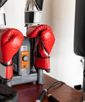 Heavy Duty Electric Shoe And Boot Dryer With Convection Heat Sweeps Moisture Out Of Work Boots And Ski Gear Four Port Quick Dry Cycle Kills Stink For Garage And Home Use with red boxing gloves