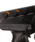 Close-up of DX3 Smart Three Channel Transmitter controls for RC cars and trucks, featuring foam wheel and DSMR tech.