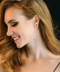 Hypoallergenic Titanium Earrings For Sensitive Ears With 14K Gold Plated Opal Ball CZ Heart Flat Back For Women And Men All Day Comfort And Everyday Wear Small Surgical Steel Flatback Stud Hoop Cartilage Earring Set Designed For Multiple Piercings, model wearing 3 studs and a gold hoop