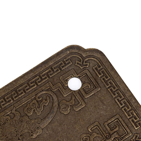 Detail view of Antique Bat Style Brass Drawer Pull Handle with intricate pattern and screw hole for cabinets wardrobes and dressers