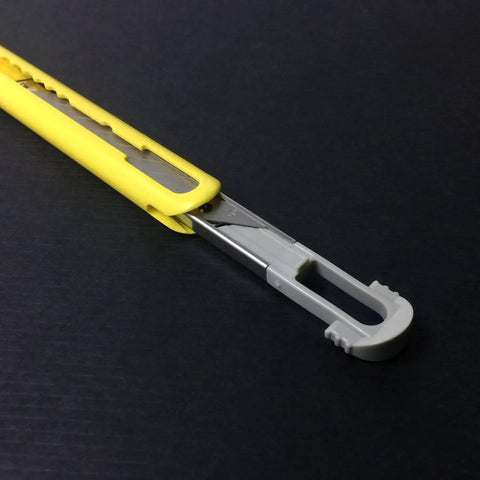 Close-up of ABS Grip 30-Degree Multi-Blade Cartridge Knife With Five Blade Cartridges, yellow handle, blade exposed.
