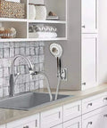 Sink Hose Shower Sprayer Attachment With Five Adapters for kitchen use, attached to faucet in modern kitchen, visible hose