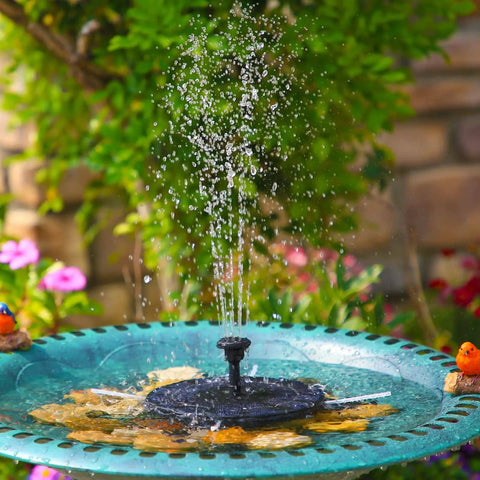 2.5W Solar Bird Bath Fountain Pump With 6 Nozzles For A Fresh Water Splash in garden setting with blooming flowers