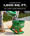 Hand Powered Spreader For Grass Seed And Lawn Fertilizers Salt And Ice Melt in use, pouring material into green spreader