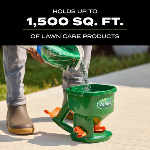 Hand Powered Spreader For Grass Seed And Lawn Fertilizers Salt And Ice Melt in use, pouring material into green spreader