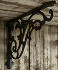 16 Inch Cast Iron Shelf Brackets 4 Pack Black Corbels Built Different Heavy Duty Wall Mounted Shelf Supports Up To One Hundred Pounds With Mounting Hardware side view detailing ironwork design