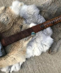Custom Handmade Bear Engraved Decorative Hammer For Blacksmiths And Crafters on a fur mat, showcasing intricate bear design.