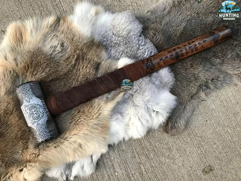 Custom Handmade Bear Engraved Decorative Hammer For Blacksmiths And Crafters on a fur mat, showcasing intricate bear design.