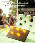 96 Ft Outdoor Solar String Lights With Remote And USB Port illuminating a cozy backyard scene with timer option display.
