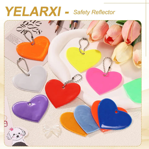 Colorful PVC heart-shaped reflector keychains displayed on a tray, showcasing the Go-To Pink Heart Shaped Reflector Keychain Set.