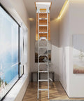 Ten Foot Aluminum Attic Ladder With Pull Down System Retractable Loft Stairs Foldable Loft For Rough Opening Twenty Two And A Half Inch By Fifty Four Inch Fits Seven Point Six To Ten Point Two Five Foot Ceilings Holds 350 Pounds installed in a hallway