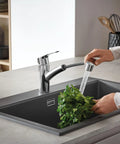 Using Eurosmart Dual Spray Pull Out Kitchen Faucet With Sprayer 1.75 GPM Chrome Durable Stainless on leafy greens in sink.