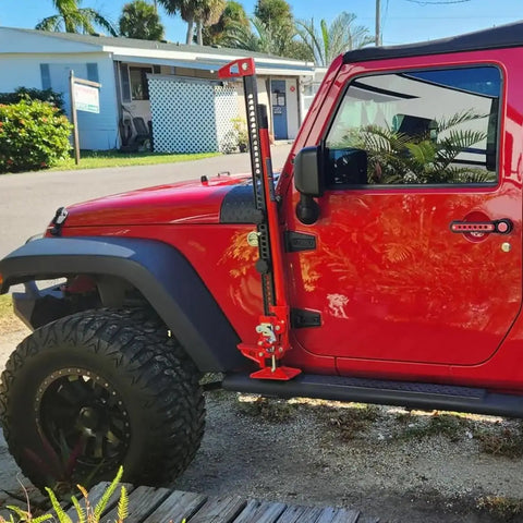 Beefy 48 Inch Ratcheting Off Road Utility Farm Jack, 3 Ton Capacity in use on a red Jeep showing multi-directional lifting