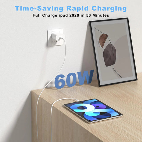 White USB-C to USB-C charging cable plugged into wall outlet beside a tablet on a wooden desk, 60W.