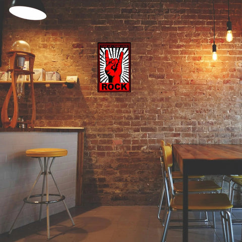 Xanovir Music tin sign on brick wall; red and black rock hand graphic with ROCK text, 8 x 12 inches