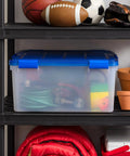 60-Quart Clear Airtight Storage Totes with Secure Latching Lid Stackable Plastic Containers for Garage Basement Closet That Are Built Different and Handle the Heat like Pros on a shelf with sports equipment.