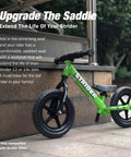 Green balance bike with Performance Seat With XL Post For 12 And 14X Balance Bikes Extends Seat Height From 15 To 19 Inches Quick No Tool Assembly on stone steps