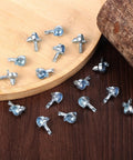 Legit Heavy Duty Zinc Alloy Shelf Pegs Replacement Pins For Classic Modular Bookshelves And Standard Shelving Units on wooden surface.