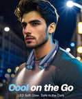 Man wearing Hands Free Neck Fan With LED Book Light, Portable Cooling For Outdoor And Indoor Use in urban night setting