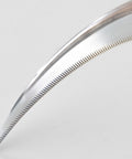 Close-up of sharp saw-tooth blade on a garden sickle for no-fuss weeding and harvesting grass weeds and perennials, made in Japan.