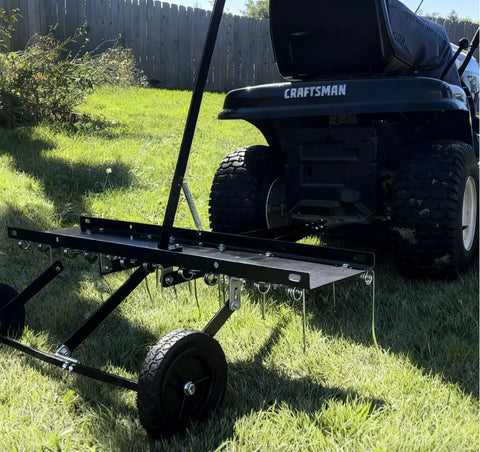Tow Behind Dethatcher Powerful 40 Inch With 20 Spring Steel Tines Lift Handle attached to mower on lawn